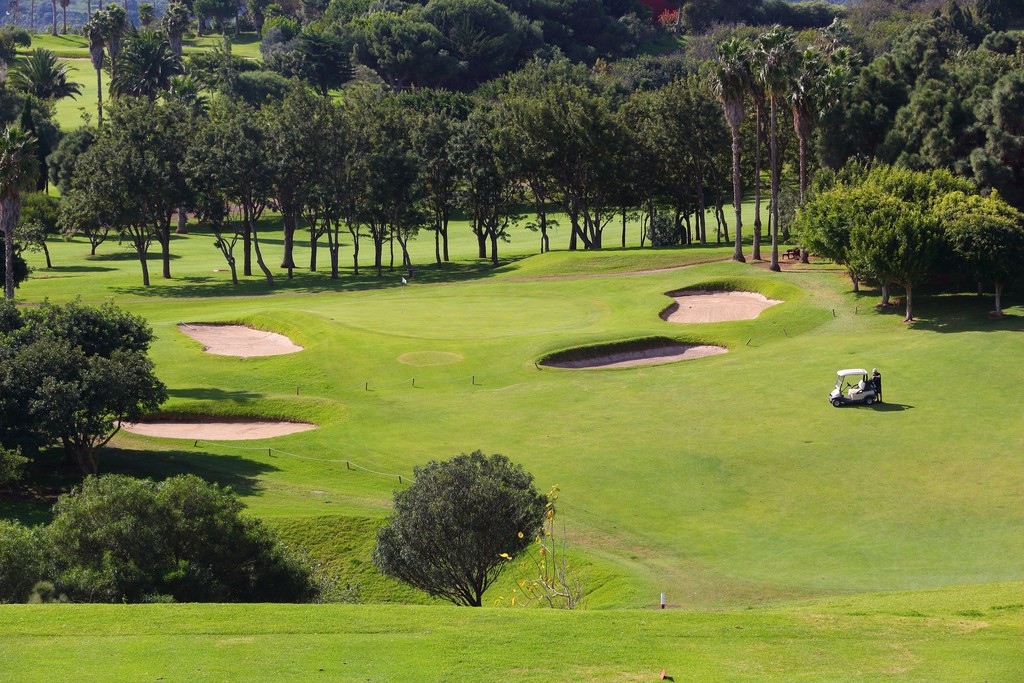 GRAN CANARIA, SPAIN - DECEMBER 6, 2015: People visit Real Club de Golf Las Palmas in Gran Canaria, Spain. Canary Islands are a notable golfing destination with year round golf weather.