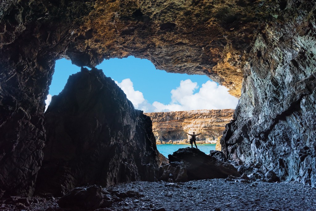 Silhouette of woman inside the caves of Ajuy, Fuerteventura, Spain