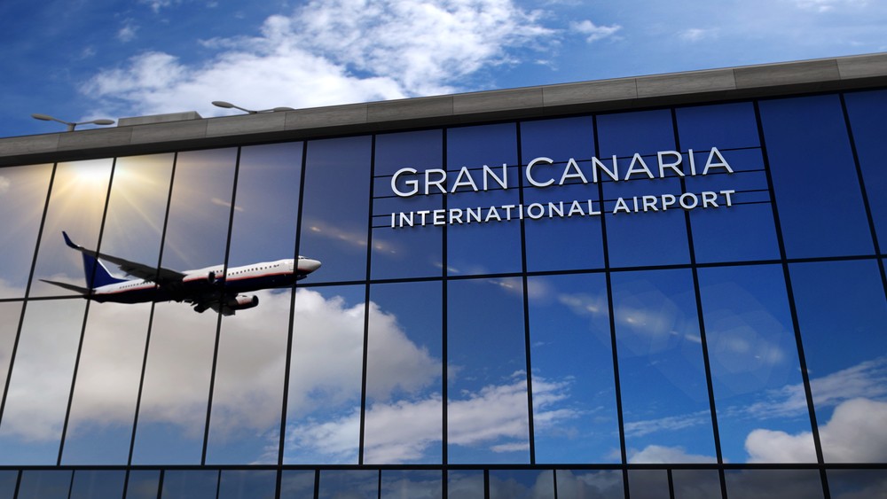 Jet aircraft landing at Gran Canaria, Canary Spain 3D rendering illustration. Arrival in the city with the glass airport terminal and reflection of plane. Travel, tourism and transport concept.
