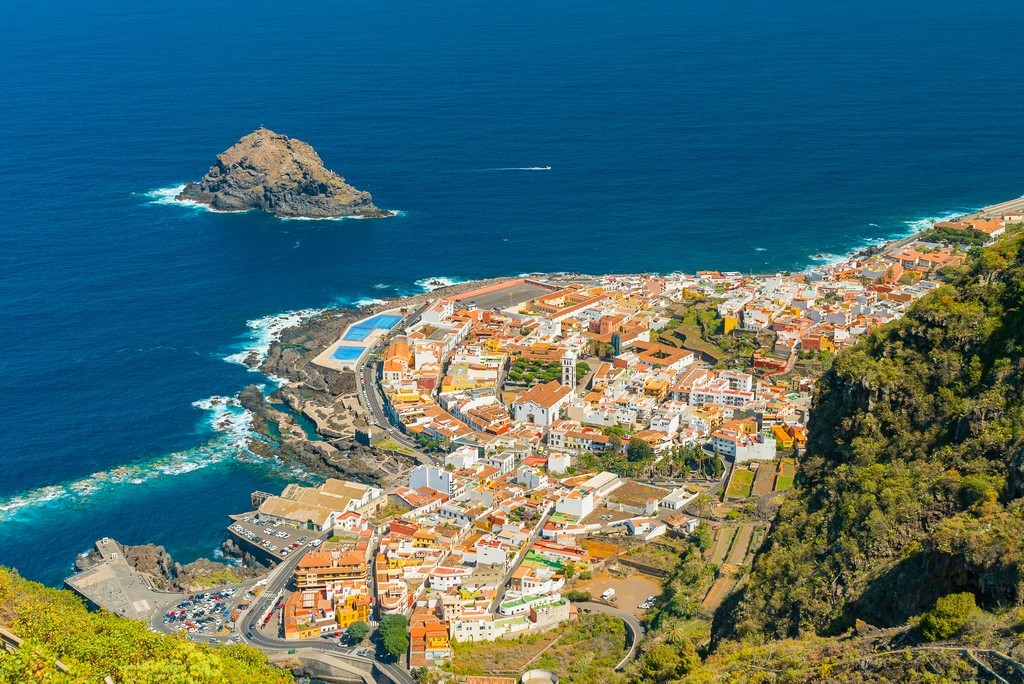 Beautiful panoramic view of a cozy Garachico town on the ocean shore from the high mountain, Tenerife, Canary Islands, Spain