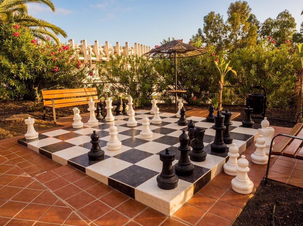 Costa Adeje, Teneriffe, Canary Islands, Spain. September 6th 2017. Evening light over giant chess set at hotel Refency Torviscas, Costa, adeje, Teneriffe, Canary islands, Spain