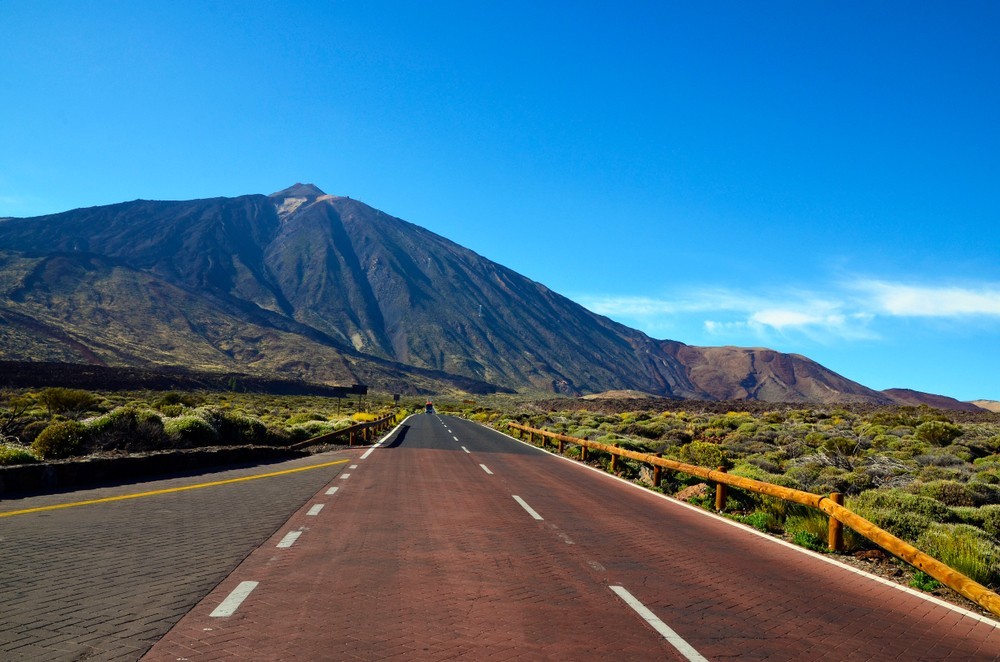 Road towards volcano El Teide at the valley of National Park of Las Canadas,Tenerife.Mount Teide is the Canary Islands most visited tourist attraction.