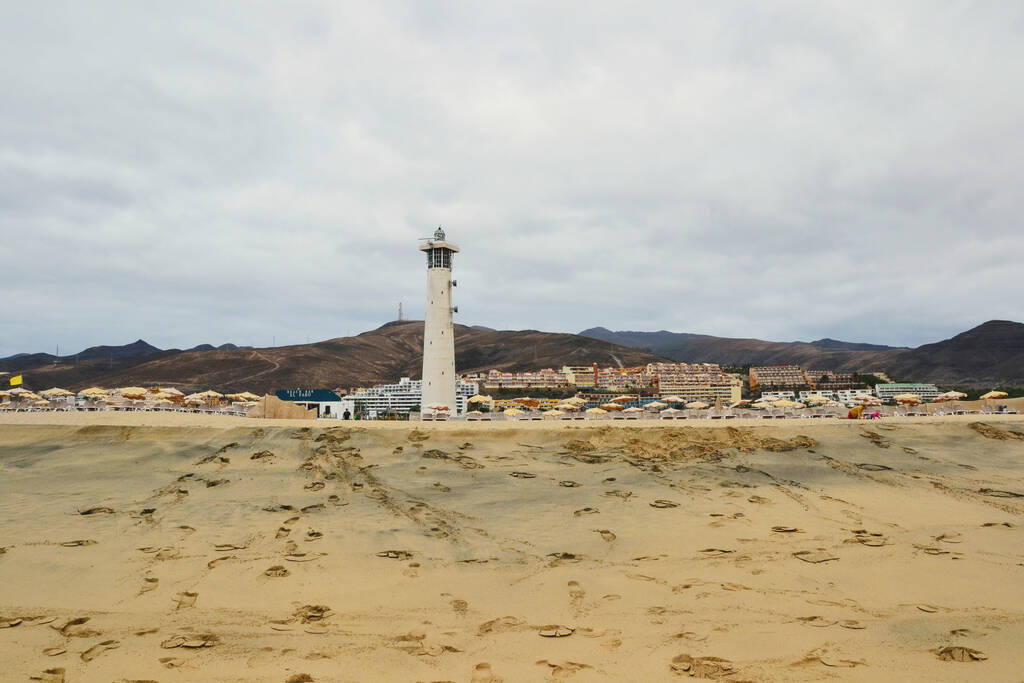 Morro Jable, Fuerteventura, Spain - January 2013: A picturesque summer view at the famous Playa del Matorral beach and lighthouse in Morro Jable, on the Canary Island of Fuerteventura, Spain