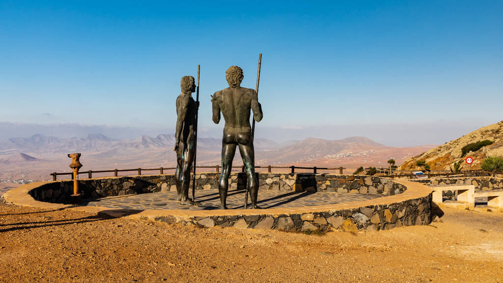 Betancuría, Canary Islands - September 11 2018: The Morro Velosa Statues at lookout point "Mirador de Guise y Ayose", overlooking the volcanic landscape of Antigua municipality.