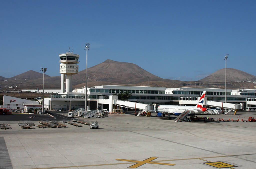 Canary islands, Spain - November 23, 2005: General view of the Lanzarote international airport with planes parked in front of the control tower