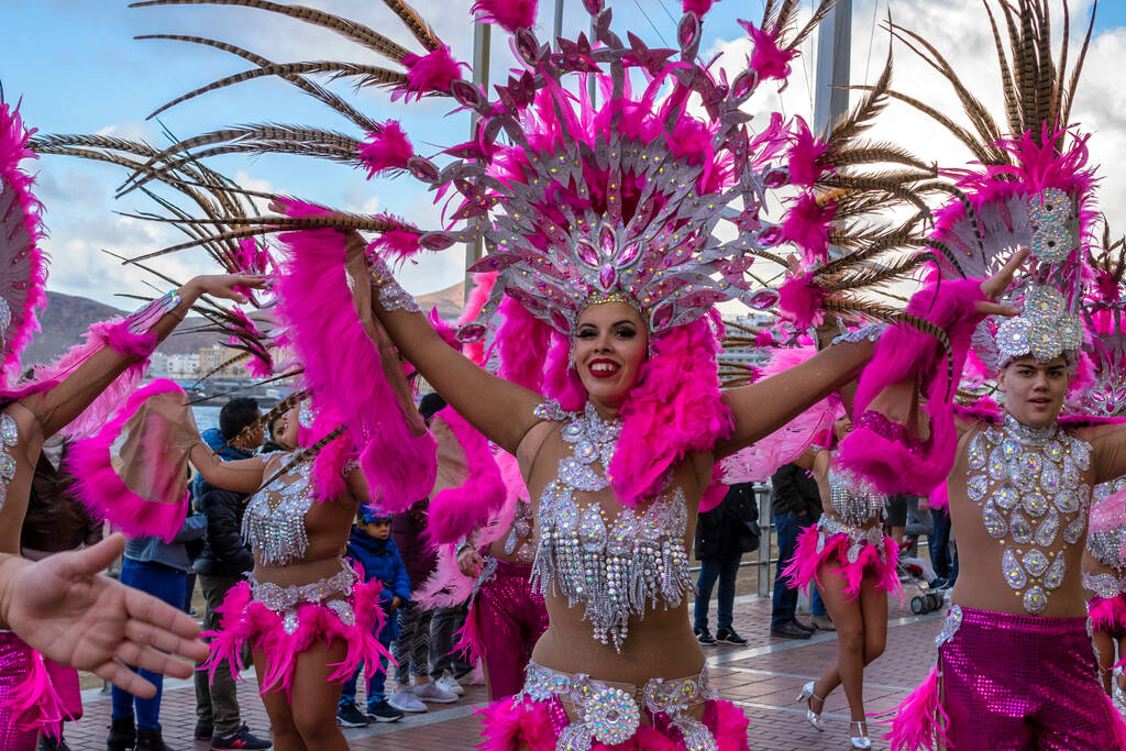 LAS PALMAS, GRAN CANARIA, SPAIN - FEBRUARY 14: Women and men dressed in carnival costume dances in Las Palmas carnival 2018 street parade
