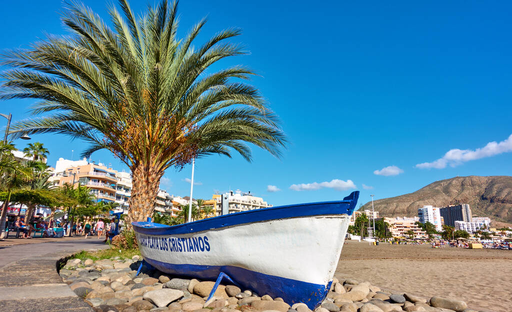Los Cristianos, Tenerife, Spain - December 12, 2019: Waterfront and sandy beach in Los Cristianos, Tenerife Island, The Canaries