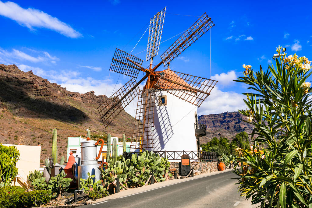 Traditional village Mogan with old windmill , Canary island. Grand Canary