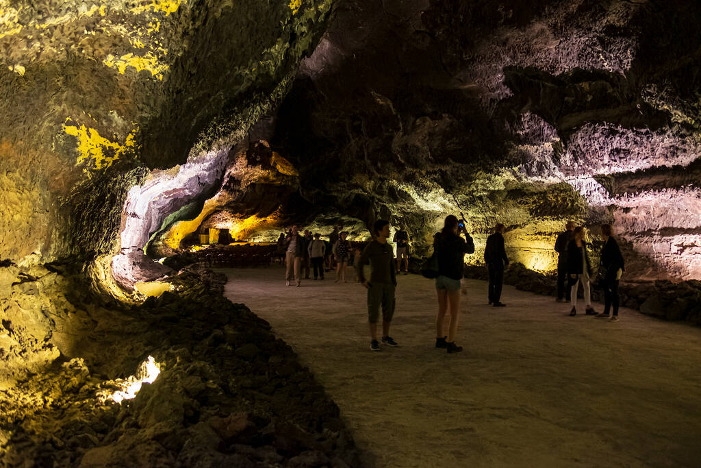 Lanzarote, Spain - March 13, 2017:  Lava tube created around 3,000 years ago in northern Lanzarote (Cueva de los Verdes). People visiting. 